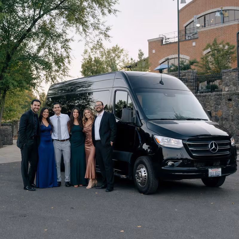 Group beside a Mercedes Sprinter limo from the Spokane fleet