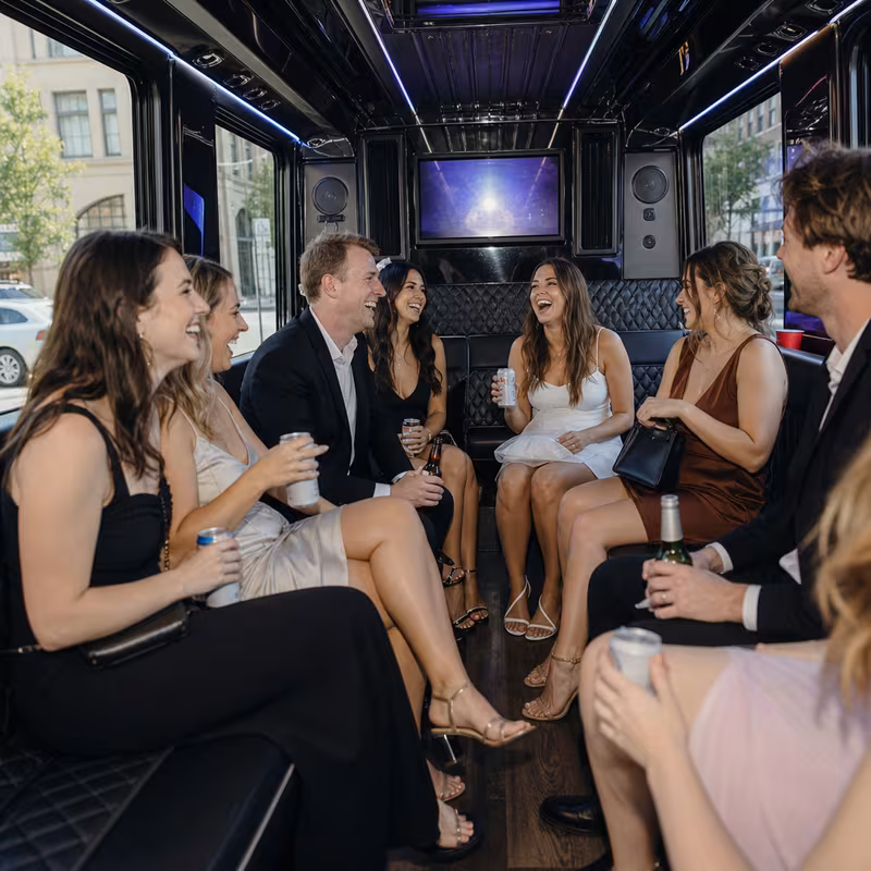 Party bus interior with wraparound leather seating and LED lighting in Spokane