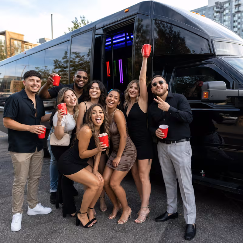 Group boarding a white charter bus for Birthday Transportation transportation in Spokane