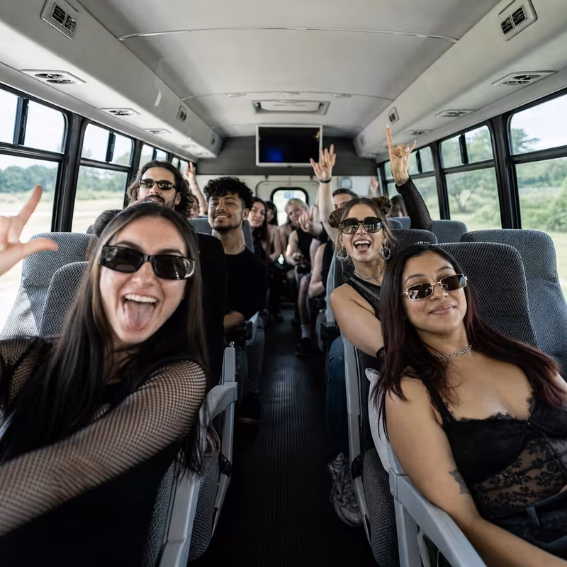 Party bus interior with wraparound leather seating and LED lighting in Spokane