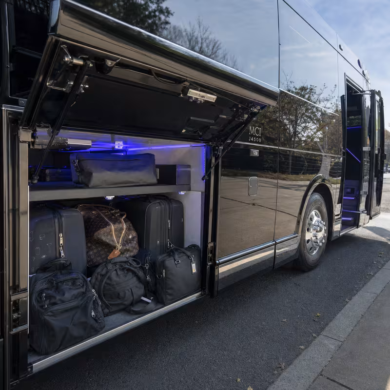 Party bus interior with wraparound leather seating and LED lighting in Spokane