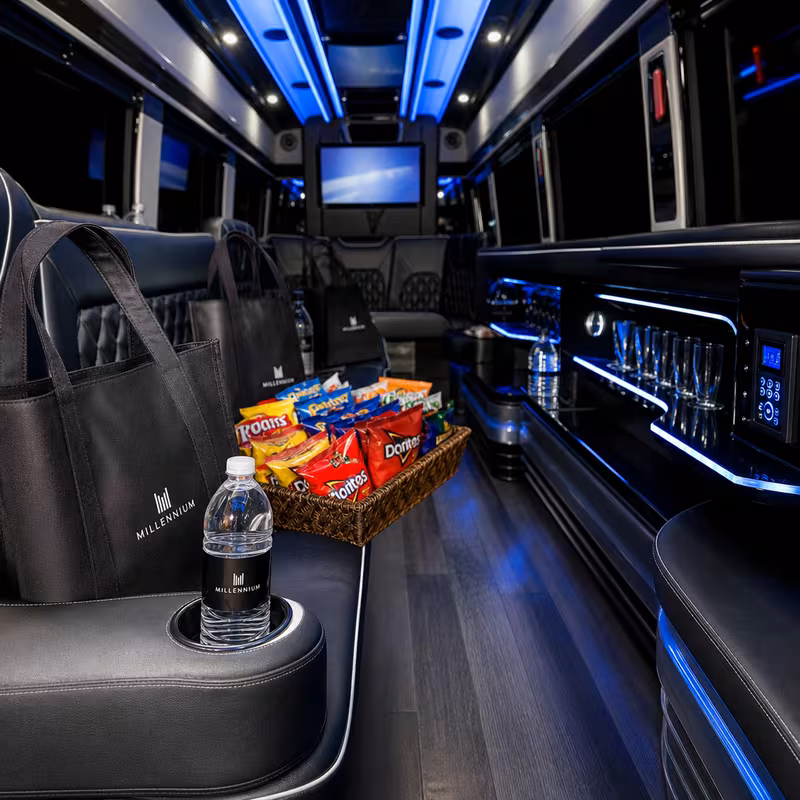 Party bus interior with wraparound leather seating and LED lighting in Spokane