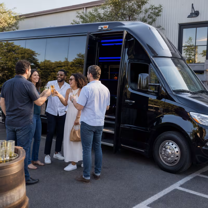 Passengers loading luggage while boarding an Spokane group shuttle